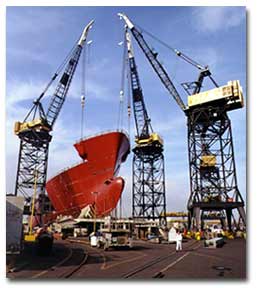 Cranes lifting hull of ship at NASSCO.