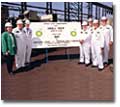 Members of the BP Site Team pose following the June 2002 First Cut Ceremony for the first BP tanker, Hull 484. The first cut was made by Seme Newlin, Project Accountant (standing left).