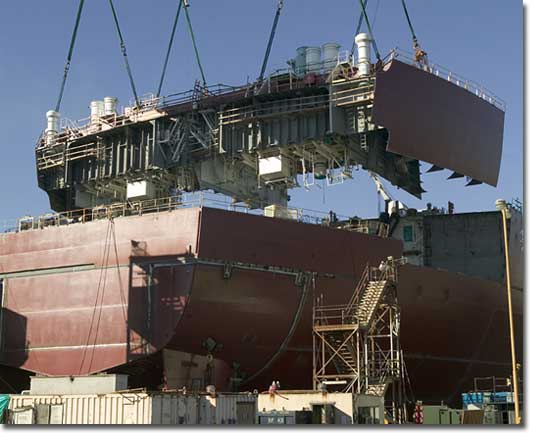A stern section block is lowered onto BP-4 at the NASSCO shipyard.