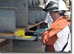 At the keel-laying ceremony for Hull 487, the fourth of the Alaska Class double-hull oil tankers being constructed for BP Oil Shipping Company, BP's Site Team Member John Penso drove in the first wedge and then welded his initials into the keel to signify the start of structural erection.
