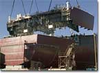 A stern section block is lowered onto BP-4 at the NASSCO shipyard.