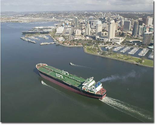 The ship passes by the downtown San Diego skyline on its way to successful sea trials.