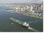 The ship passes by the downtown San Diego skyline on its way to successful sea trials.