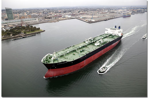 The Alaskan Frontier leaves San Diego Bay and the downtown skyline behind as it heads out to sea and begins its first voyage. The ship was delivered to BP in August 2004.