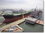 The Alaskan Legend shares a pier at General Dynamics NASSCO prior to its August 18, 2006 delivery to BP Shipping Ltd.