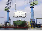 The house block for PC-1 is lifted into place in the Spring of 2008.