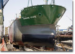 The upper bow section is placed aboard Hull 503 on July 2, 2009.