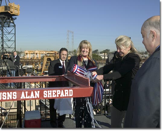 As Juliana Shepard Jenkins looks on, Laura Shepard Churchley breaks the bottle of champagne on the bow of the ship named in honor of their father, Rear Adm. Alan Shepard, the first American into space.&nbsp;