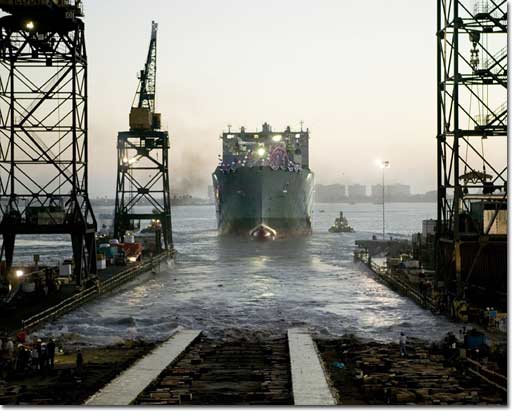 Amid cheers from the crowd and bursting fireworks, the USNS Lewis and Clark slid from the building ways into the waters of San Diego Bay. More than 5,000 people attended the christening and launching ceremony.