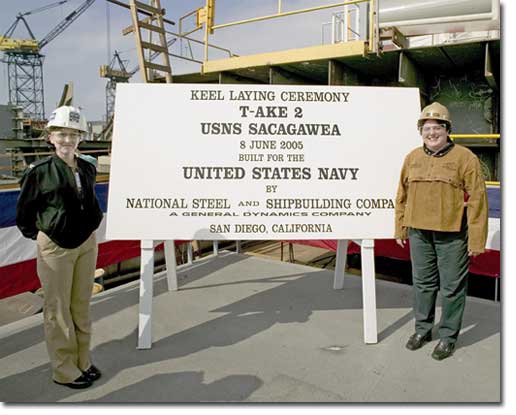 U.S. Navy Capt. Patricia Sudol (L), program manager for the T-AKE, poses with Deputy Assistant Secretary of the Navy (Ships) Allison Stiller, who welded her initials into the ship's keel to signify the beginning of full-scale production on the new ship.