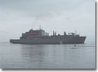 The 210-meter-long USNS Lewis and Clark (T-AKE 1) prepares to steam under its own power for the first time.