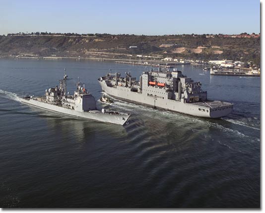 Sacagawea (T-AKE 2) sails past USS Mobile Bay (CG 53) enroute to sea trials.