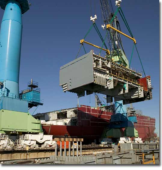 A two-deck section is lifted for placement onboard T-AKE 2 in January 2006.
