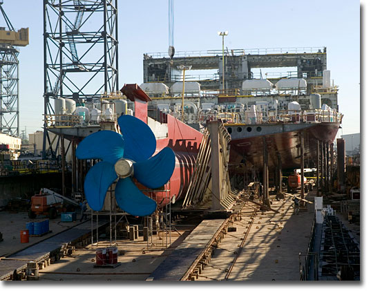 A stern view of T-AKE 2, as she sits on the building ways at General Dynamics NASSCO in the fall of 2005.
