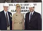 U.S. Navy Rear Admiral Carol M. Pottenger, Commander, Military Sealift Fleet Support Command, was the honoree for the February 14, 2006, keel-laying event, welding her initials into the keel of the T-AKE 3, the USNS Alan Shepard. With her are Dave Martyn, Program Manager, Naval Fleet Auxiliary Force Program (L) and Art Diaz, MSC Ship Construction Senior Owners Representative.