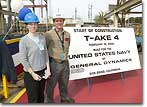 Sally Smith, spouse of Jeff Smith, ship design manager for the Naval Sea Systems Command, Arlington, Va., cut the first steel plate to signify the start of construction of the T-AKE 4 dry cargo/ammunition ship.&nbsp;Posing with her is Graham Dodd, NASSCO's Director of Steel.