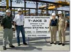 Graham Dodd, NASSCO's Director of Steel, and Mike Trimble, Military Sealift Command (MSC) Ship's Project Manager, pose with Navy Captain Mike Stanton, Commanding Officer, Supervisor of Shipbuilding, and Mrs. Jennifer Stanton, who made the first cut on the ship's first steel plate to signify the start of construction of the T-AKE 3.