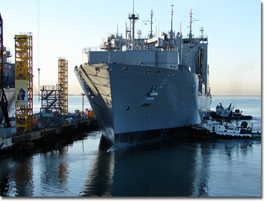 Tugs assist Sacagawea (T-AKE 2) as it leaves the NASSCO pier. 