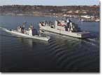 Sacagawea (T-AKE 2) sails past USS Mobile Bay (CG 53) enroute to sea trials.