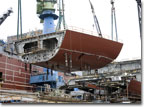 A bow section is lowered into place in June 2009.