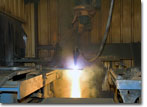 The first metal part is cut for T-AKE 12 on September 22, 2009.