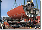 A section of the hull of the USNS Medgar Evers (T-AKE 13) lowered into place in January of 2011.