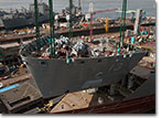 The bow section of the USNS Medgar Evers (T-AKE 13) is lifted into place in April 2011.