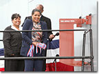 Sponsor Mrs. Myrlie Evers, accompanied by Matron Reena Evers-Everette of the christening party, prepares to christen the USNS Medgar Evers on November 12, 2011 at the NASSCO shipyard in San Diego.