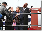 The christening party celebrates after the successful naming of the USNS Medgar Evers on November 12, 2011.