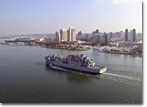 USNS Alan Shepard (T-AKE 3) passes the San Diego skyline on June 12, 2007.
