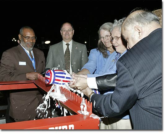 Mrs. Bolling Byrd Clarke, Admiral Richard Byrd's daughter, christens T-AKE 4.