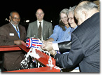 Mrs. Bolling Byrd Clarke, Admiral Richard Byrd's daughter, christens T-AKE 4.
