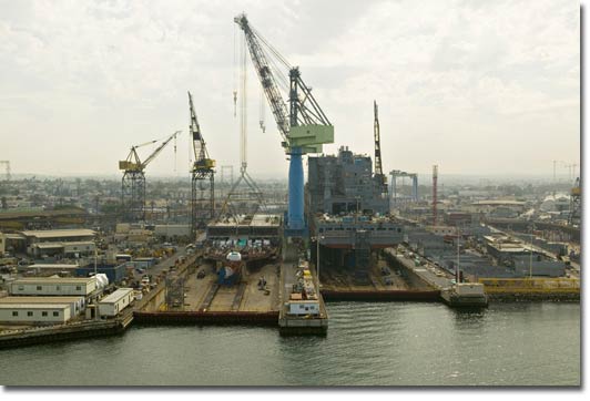 T-AKE 6 (left) and T-AKE 5 under construction at the NASSCO shipyard in July 2007.