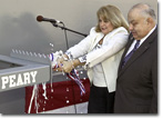 As NASSCO President Fred Harris looks on, Florida Circuit Court Judge Peary Fowler christens USNS Robert E. Peary (T-AKE 5) on February 9, 2008.