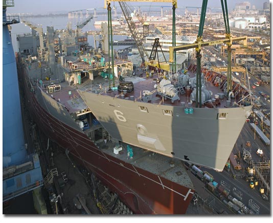 The 500-ton bow section of T-AKE 6 is lifted into place on October 25, 2007.
