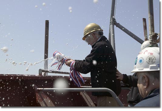 Ship Sponsor Mrs. Amy Kleppner christens her aunt's namesake ship with champagne.