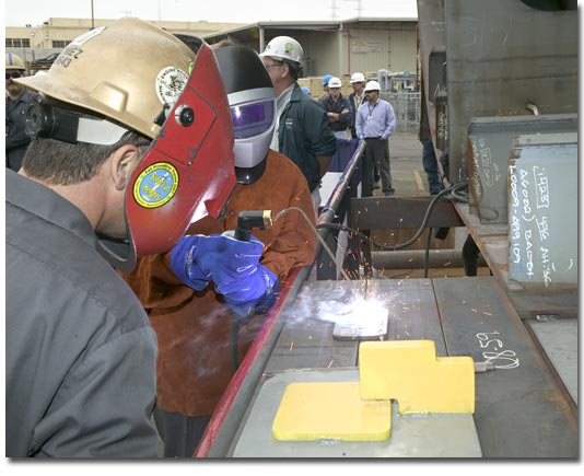 Ms. Darlene Costello helps lay the keel of T-AKE 6 on May 30, 2007.