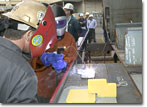 Ms. Darlene Costello helps lay the keel of T-AKE 6 on May 30, 2007.