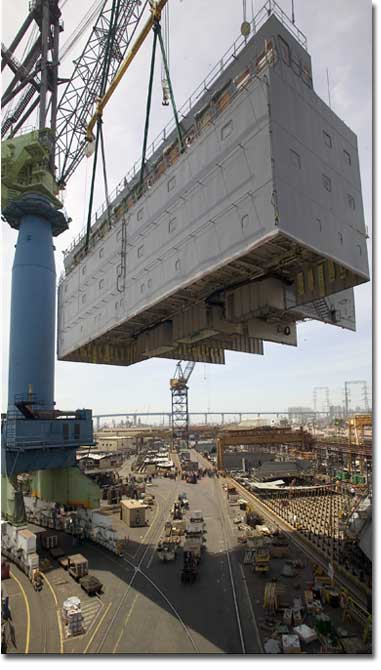 The 563-ton House Block for T-AKE 7, including its bridge, is lifted for installation aboard the ship on May 14, 2008.