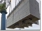 The 563-ton House Block for T-AKE 7, including its bridge, is lifted for installation aboard the ship on May 14, 2008.
