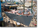 T-AKE 8's bow section is lifted into place on September 11, 2008.