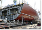 A forward hull section of T-AKE 8 is put into position on June 27, 2008.