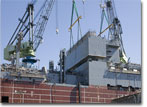 The house block is lifted onboard USNS Matthew Perry on May 6, 2009.