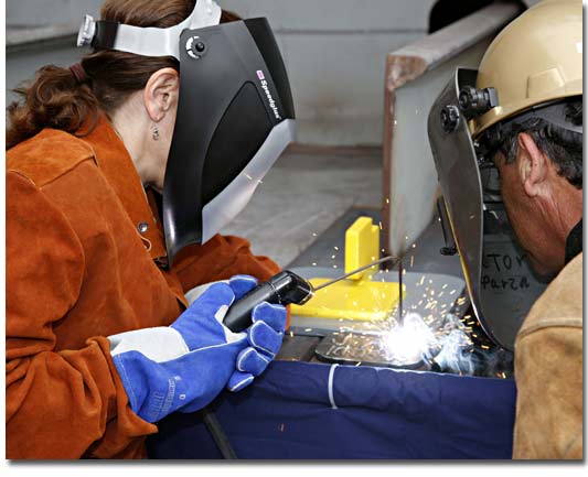 Mrs. Joan Divens helps lay the keel of T-AKE 9 on October 3, 2008.