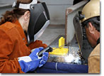 Mrs. Joan Divens helps lay the keel of T-AKE 9 on October 3, 2008.