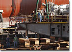 NASSCO employees lay a keel block for T-AKE 9 on the building ways in October 2008.