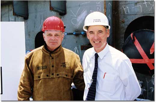 Richard Griffith (L), Vice President of Operations of Totem Ocean Trailer Express, Inc. (TOTE), and Jim Scott, Vice President of Marketing and Business Affairs of General Dynamics NASSCO (NASSCO), pose at the keel-laying ceremony for the M. V. North Star, the second of two ORCA-class roll-on/roll-off trailerships being built for TOTE's Tacoma-to-Anchorage service. Griffith drove in a wedge that signified the fit-up of the ships first keel blocks and then welded his initials onto a steel plate that will become a permanent part of the ship.