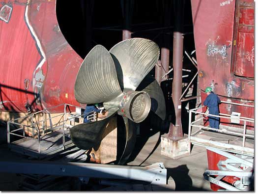 One of two giant propellers is installed on the M.V. North Star.  Four diesel-electric engines will power the trailership to speeds of more than 24 knots.