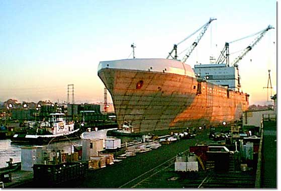 The M.V. North Star reflects the colors of the evening sun as she is floated out from NASSCO's graving dock. 