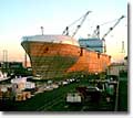 The M.V. North Star reflects the colors of the evening sun as she is floated out from NASSCO's graving dock. 